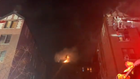 FDNY firefighters battle a five-alarm fire in Manhattan apartment building.