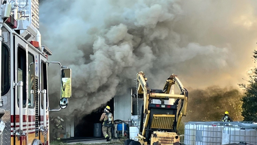Firefighters battle a well involved fire in a Orange County, FL, honey production operation on Nov. 24, 2021.