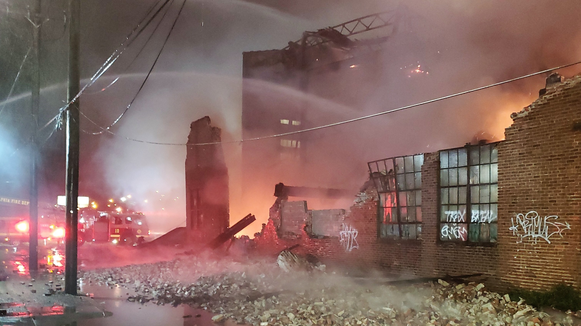 The aftermath of a collapse during a four-alarm fire at a vacant warehouse in the Port Richmond section of Philadelphia on Sunday, Oct. 31, 2021.