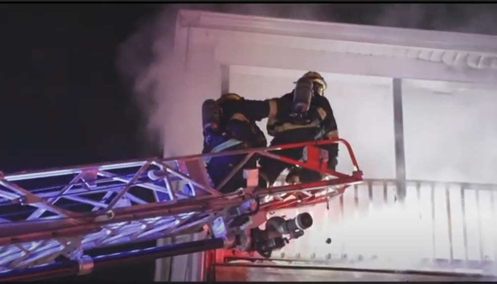 Firefighters work to extinguish a fire intentionally set on Nov. 29, 2021.