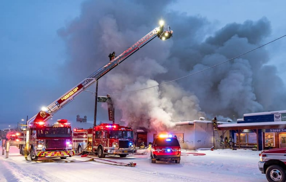 Heavy smoke pushes out of a vacant commercial structure in Fairbanks.