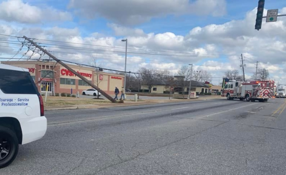 Heavy winds dropped powerlines onto a Rogers fire apparatus and subsequently trapping the crew inside.