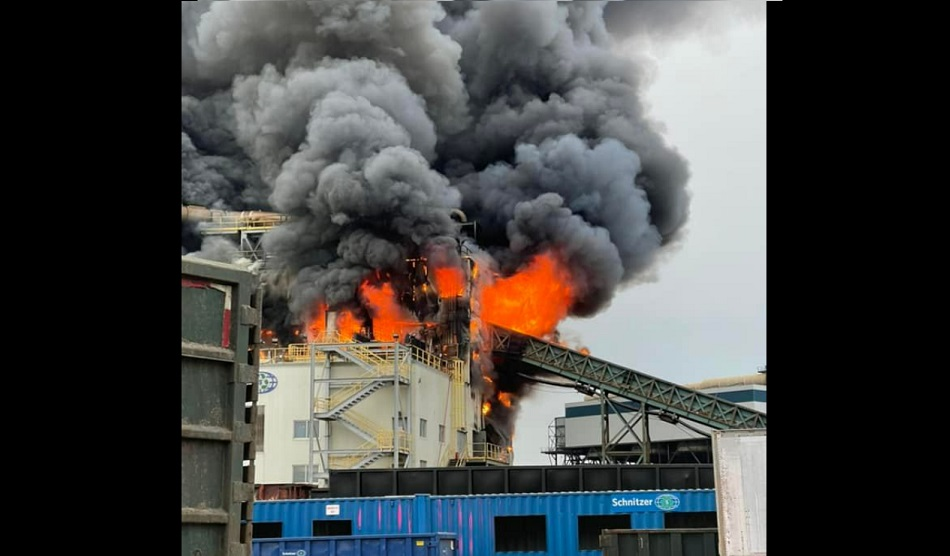 Fire consumes a multi-story building at an Everett recycling center on Dec. 8, 2021.
