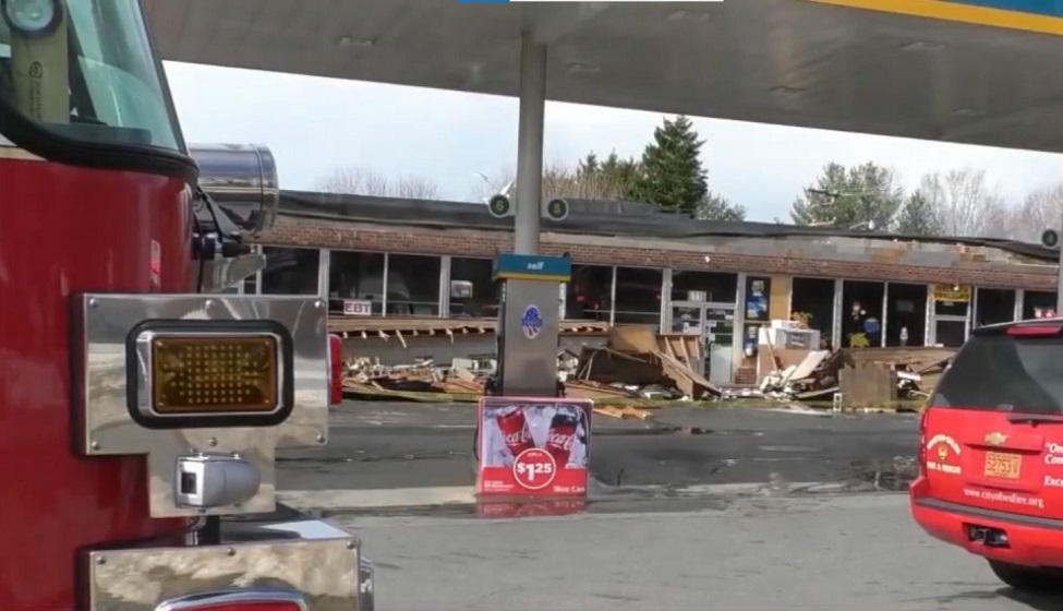 Winston-Salem firefighters assisted three people to safety after and awning collapsed trapping them.