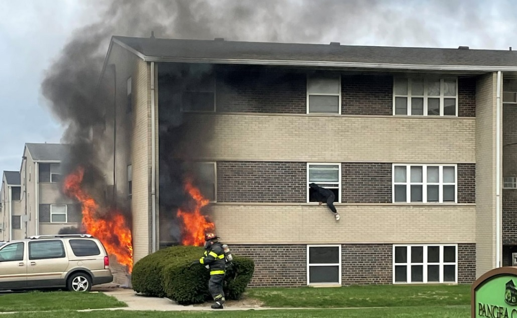 Indianapolis firefighters rescued 20 occupants and 5 cats while operating at a three-story apartment fire.