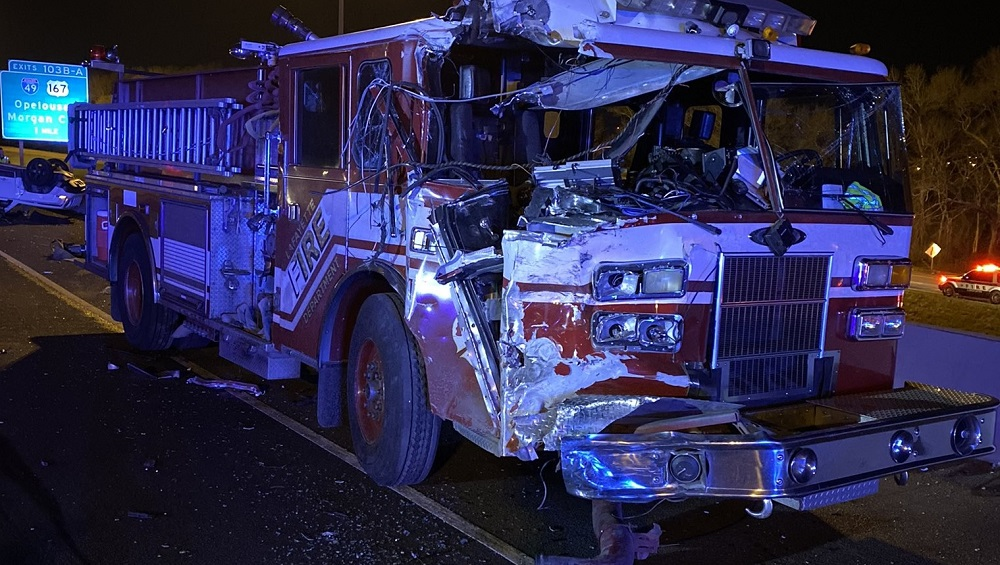 A Lafayette firefighter is in serious but stable condition after jumping off an overpass to avoid being struck by a semi.