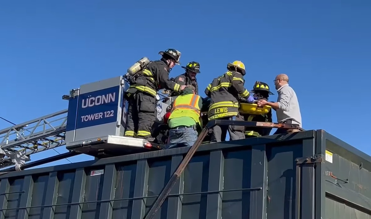 A dumpster truck driver positioned his vehicle allowing a fire victim to jump to safety from a second-floor window at a Willimantic structure fire.