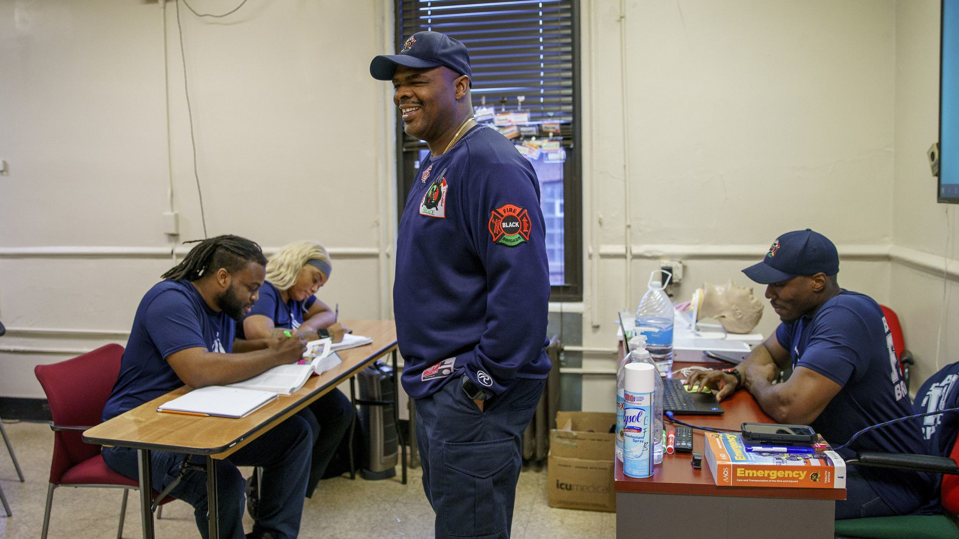 Chicago Fire Department Lt. Quention Curtis with students at the Black Fire Brigade in the Washington Park neighborhood on April 7, 2022, in Chicago.