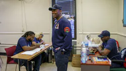 Chicago Fire Department Lt. Quention Curtis with students at the Black Fire Brigade in the Washington Park neighborhood on April 7, 2022, in Chicago. Chicago Fire Department Lt. Quention Curtis with students at the Black Fire Brigade in the Washington Park neighborhood on April 7, 2022, in Chicago.