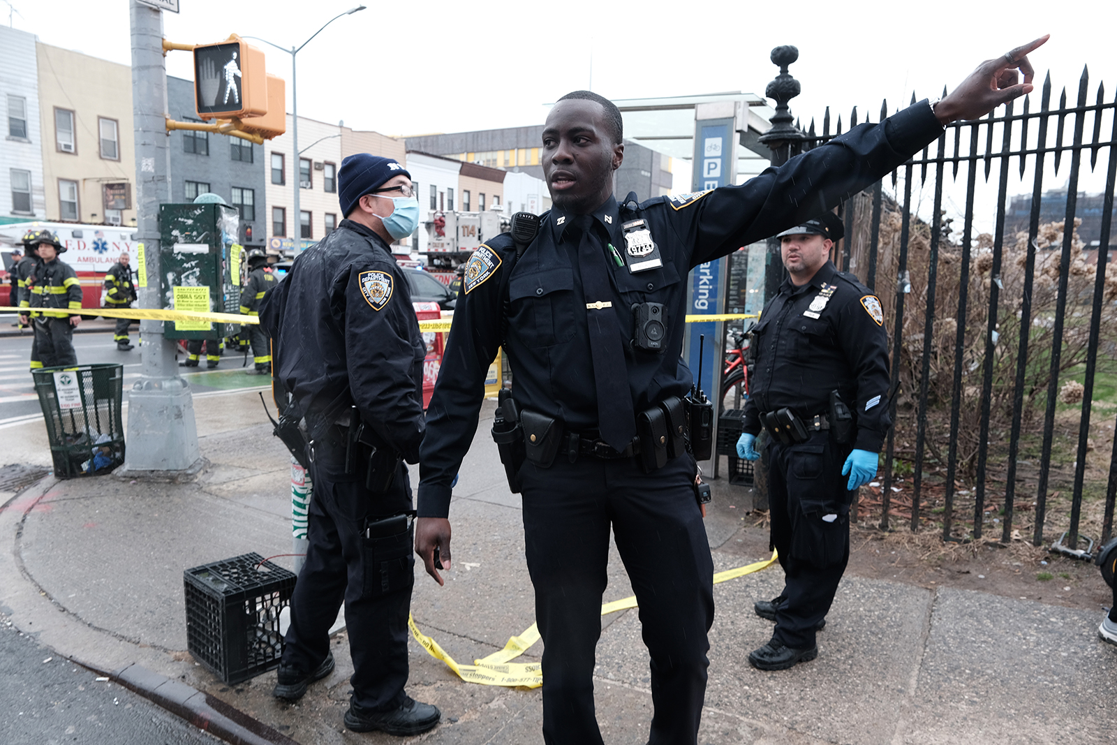 Police and emergency responders gather at the site of a reported shooting of multiple people outside of the 36 St subway station in Brooklyn borough.