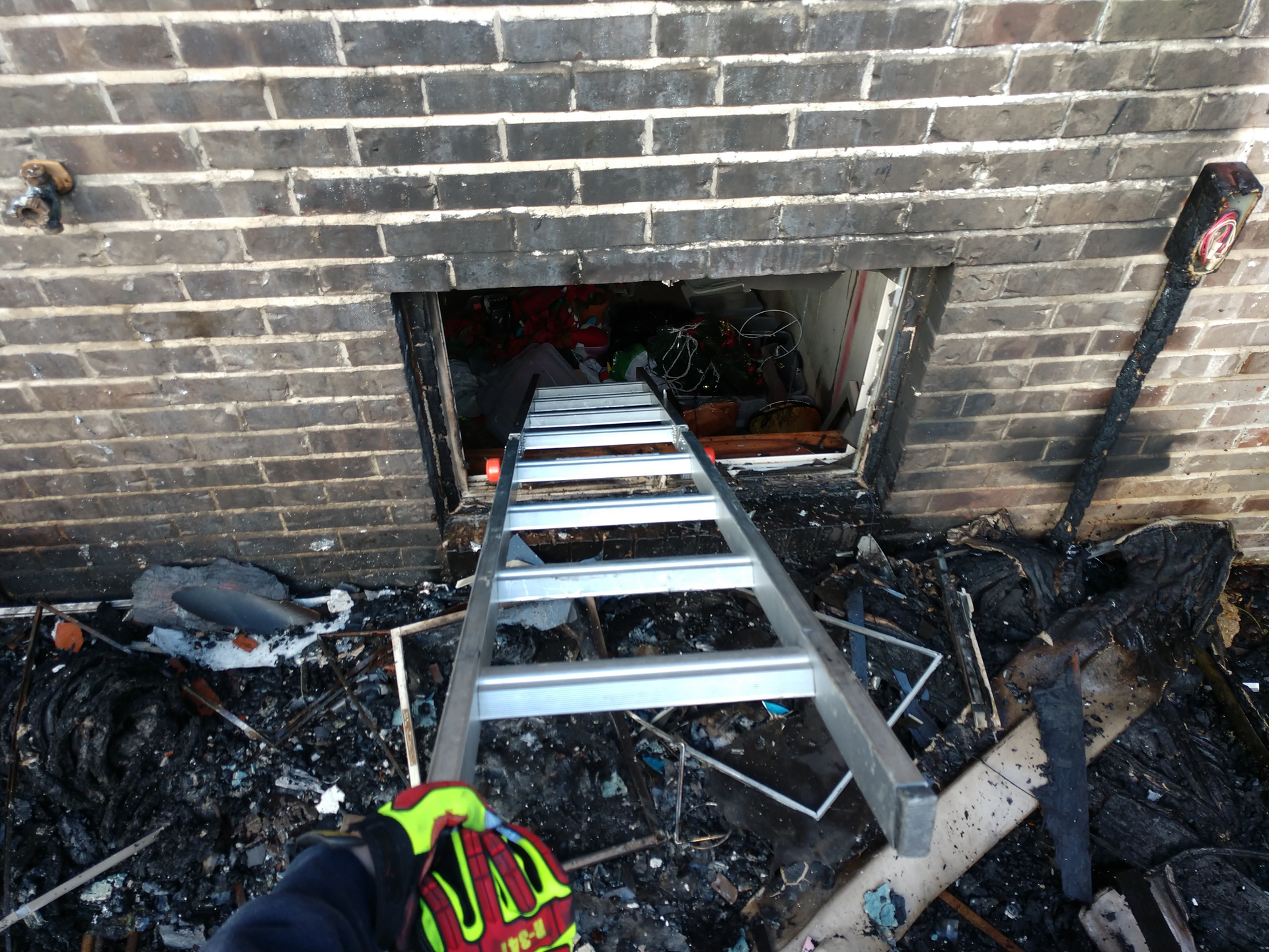 An interior crew runs the risk of being disoriented in a basement should they fall through the floor after they enter a single-story house. Deploying a multipurpose ladder into a basement window might give those members a quick exit path or provide a quick entry path for a RIT.
