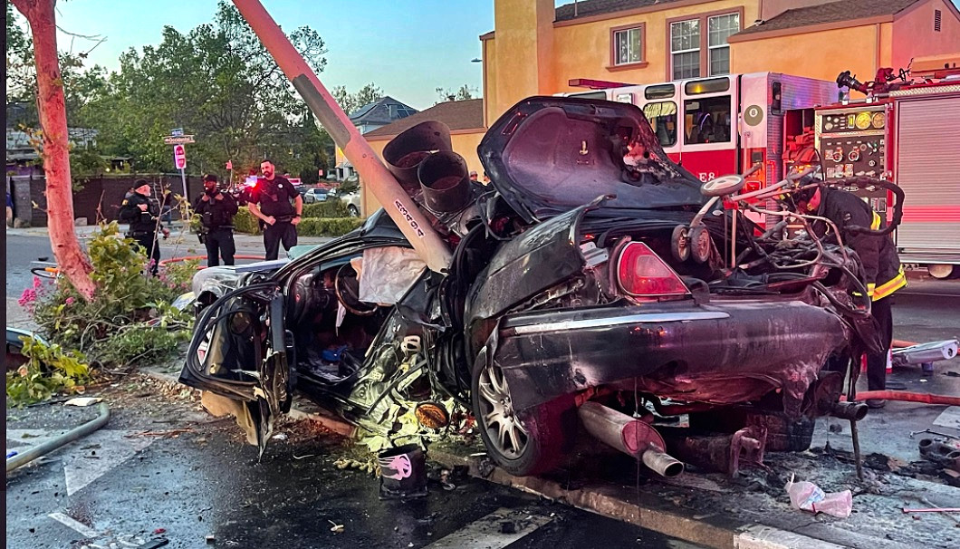 Oakland residents and firefighters teamed up to save a man following an accident and fire that trapped him in his vehicle.