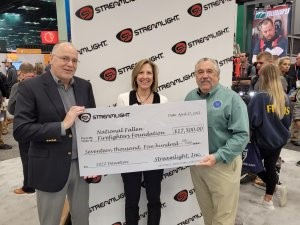 Ray Sharrah (left), President and Chief Executive Officer of Streamlight and Dawn Dalldorf-Jackson, Streamlight&rsquo;s Vice President of Distribution & Business Development, present a $17,500 donation check to NFFF Executive Director Chief Ronald Siarnicki (right) in support of the National Fallen Firefighter&rsquo;s Foundation.