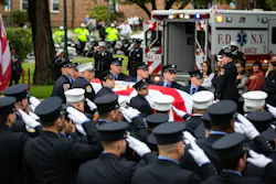 FDNY personnel salute as Capt. Alison Russo's casket is removed from the ambulance. FDNY personnel salute as Capt. Alison Russo's casket is removed from the ambulance.