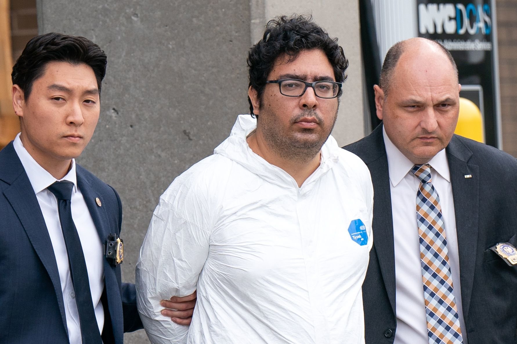 Peter Zisopoulos, center, pleaded not guilty Thursday for the stabbing death of FDNY EMS Capt. Alison Russo.