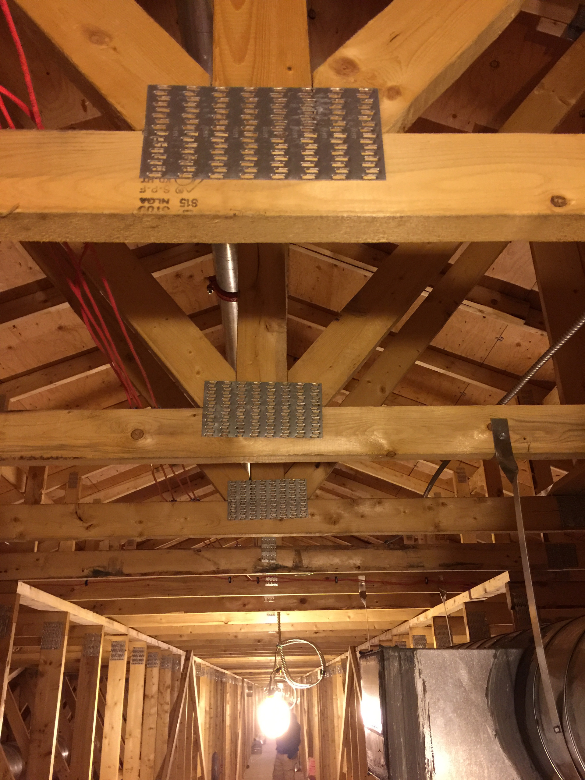 Example of the versatility of the gang nail: holding multiple pieces of a truss system in place instead of costy nails or glue.