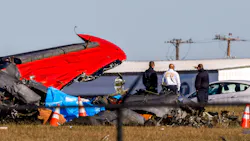 Dallas Fire-Rescue officials gather near the wreckage of a Boeing B-17 Flying Fortress and a Bell P-63 Kingcobra that crashed Saturday at the Dallas Executive Airport. Dallas Fire-Rescue officials gather near the wreckage of a Boeing B-17 Flying Fortress and a Bell P-63 Kingcobra that crashed Saturday at the Dallas Executive Airport.