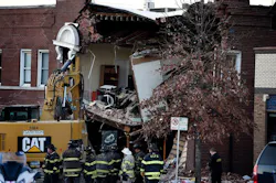 Firefighters and other officials at the scene of the Dec. 15, 2021 crash where a Kansas City Fire Department pumper struck a vehicle and building, leaving three dead. Firefighters and other officials at the scene of the Dec. 15, 2021 crash where a Kansas City Fire Department pumper struck a vehicle and building, leaving three dead.