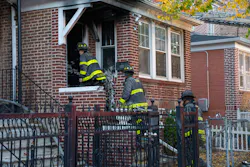 Firefighters perform overhaul at the house. Firefighters perform overhaul at the house.