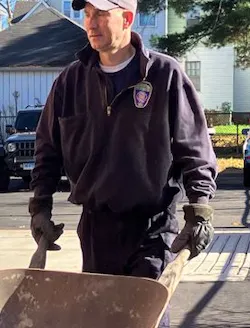 A Hartford firefighter gets ready to haul mulch. A Hartford firefighter gets ready to haul mulch.