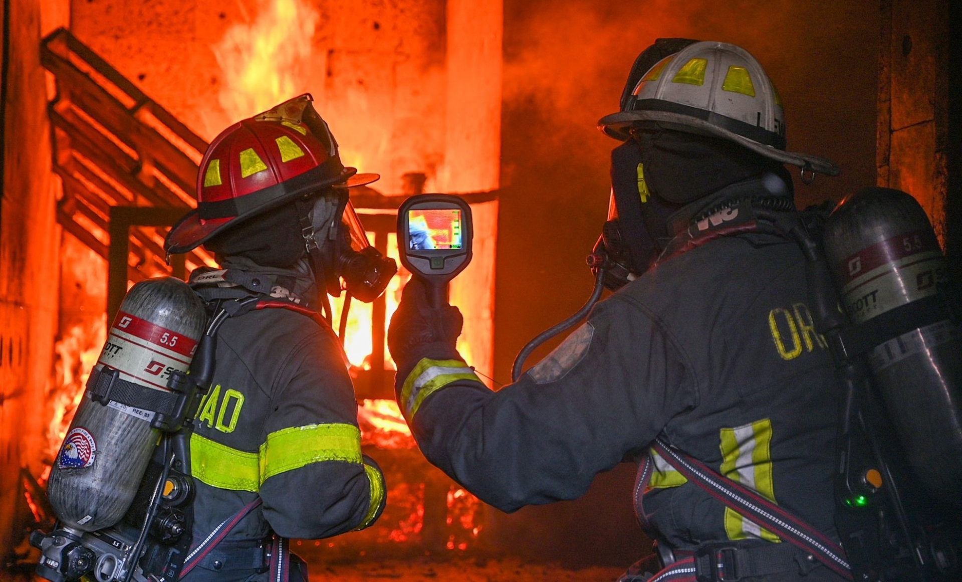 Working with crews sometimes can be more exciting than simply reviewing policies or talking tactics. Here a chief and a company officer review thermal imaging use in a live fire environment.