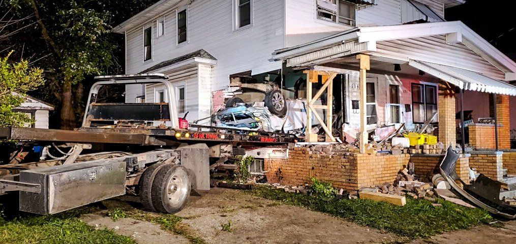While involved in a police pursuit, a vehicle left the roadway and completely entered a duplex. Two occupants were pinned in the vehicle. This resulted in a complex shoring and rescue operation. Shoring the structure also made investigating the crash and recovering the vehicle far safer for law enforcement and the tow operator than would have been the case otherwise.