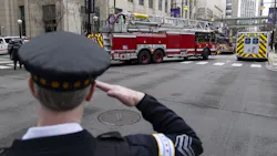A Chicago police officer salutes as an ambulance carrying the body of fallen Chicago firefighter Lt. Jan Tchoryk departs Northwestern Memorial Hospital on April 5. A Chicago police officer salutes as an ambulance carrying the body of fallen Chicago firefighter Lt. Jan Tchoryk departs Northwestern Memorial Hospital on April 5.