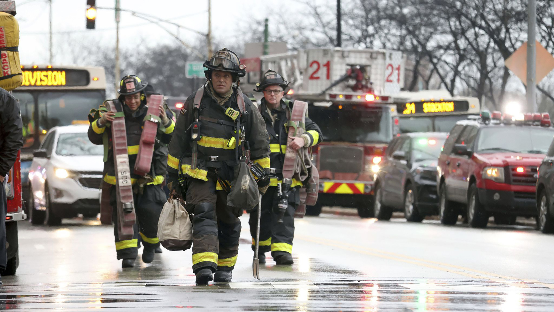 With elevators inoperable, Chicago firefighters had to haul gear up to the 27th floor.
