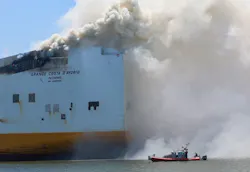Smoke pours from the Grande Costa D'Avorio cargo ship Thursday afternoon, hours after two Newark firefighters died while battling a fire reported Wednesday night. Smoke pours from the Grande Costa D'Avorio cargo ship Thursday afternoon, hours after two Newark firefighters died while battling a fire reported Wednesday night.