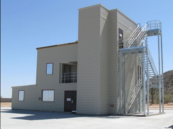 The Deputy Chief tower has four working decks. The structure resembles a residential building, but with a 30-foot tower for rappelling and laddering.