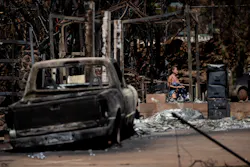 A resident reacts as she walks through the ruins of a a house destroyed by the Lahaina Fire, in Lahaina, in Maui, on Aug. 15, 2023. A resident reacts as she walks through the ruins of a a house destroyed by the Lahaina Fire, in Lahaina, in Maui, on Aug. 15, 2023.