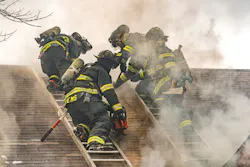 In the process of carrying out a Milwaukee cut, a firefighter on each of two roof ladders starts by cutting an approximately four-foot vertical seam that runs parallel to each ladder beam that’s closest to the hole location. In the process of carrying out a Milwaukee cut, a firefighter on each of two roof ladders starts by cutting an approximately four-foot vertical seam that runs parallel to each ladder beam that’s closest to the hole location.