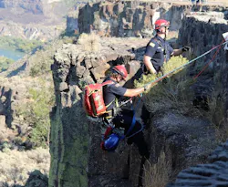TFFD firefighters descend over the edge of the cliff walls of the Snake River Canyon to work with the SORT team to rescue an injured hiker. TFFD firefighters descend over the edge of the cliff walls of the Snake River Canyon to work with the SORT team to rescue an injured hiker.