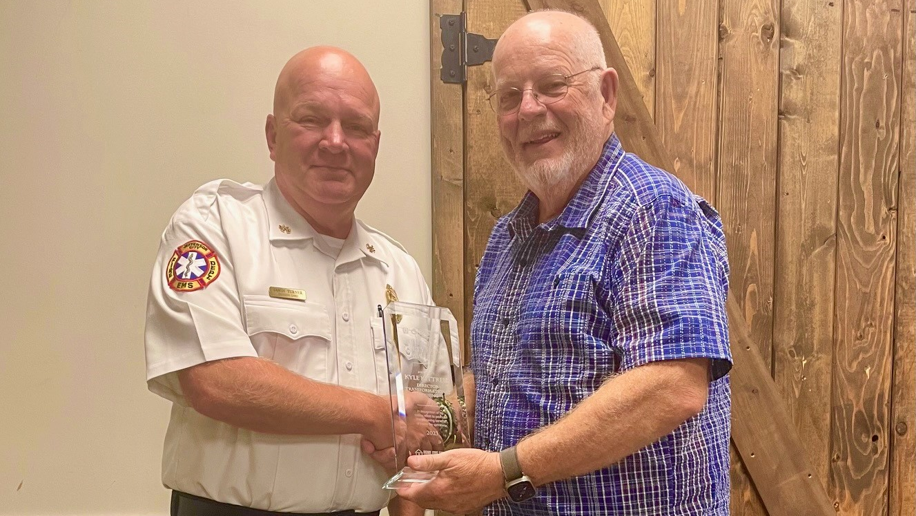 Division Chief of Prevention Jason Turner, Jefferson City Fire Department (l.) nominated Kyle Kittrell for the Bringing Safety Home Award.