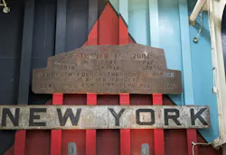 A piece of rusted steel from the Work Trade Center, hangs over the ramp on the USS New York. A piece of rusted steel from the Work Trade Center, hangs over the ramp on the USS New York.
