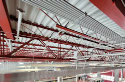 Many apparatus bays have exposed steel joists, conduit, ductwork and piping, which create countless surfaces that can collect carcinogens and are challenging to keep clean. Many apparatus bays have exposed steel joists, conduit, ductwork and piping, which create countless surfaces that can collect carcinogens and are challenging to keep clean.