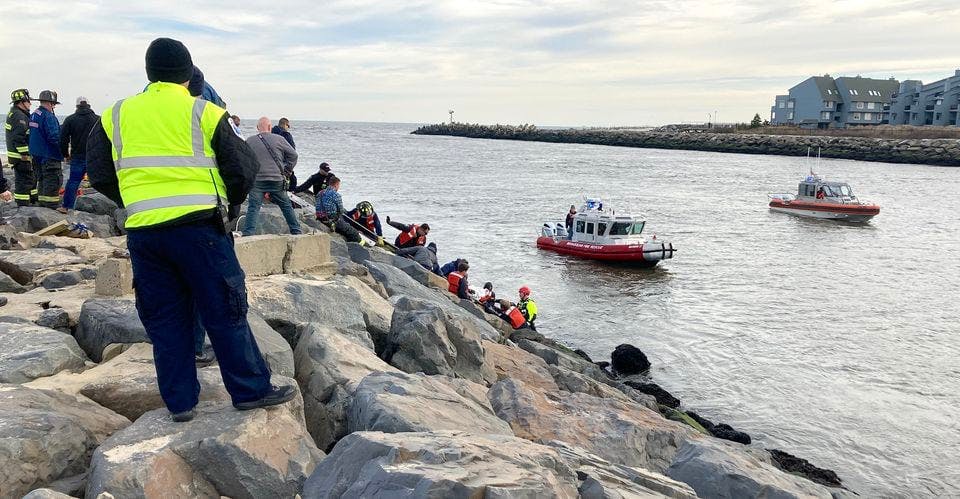 EMS crews, firefighters and civilians formed a human chain to rescue the man.