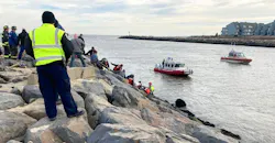 EMS crews, firefighters and civilians formed a human chain to rescue the man. EMS crews, firefighters and civilians formed a human chain to rescue the man.