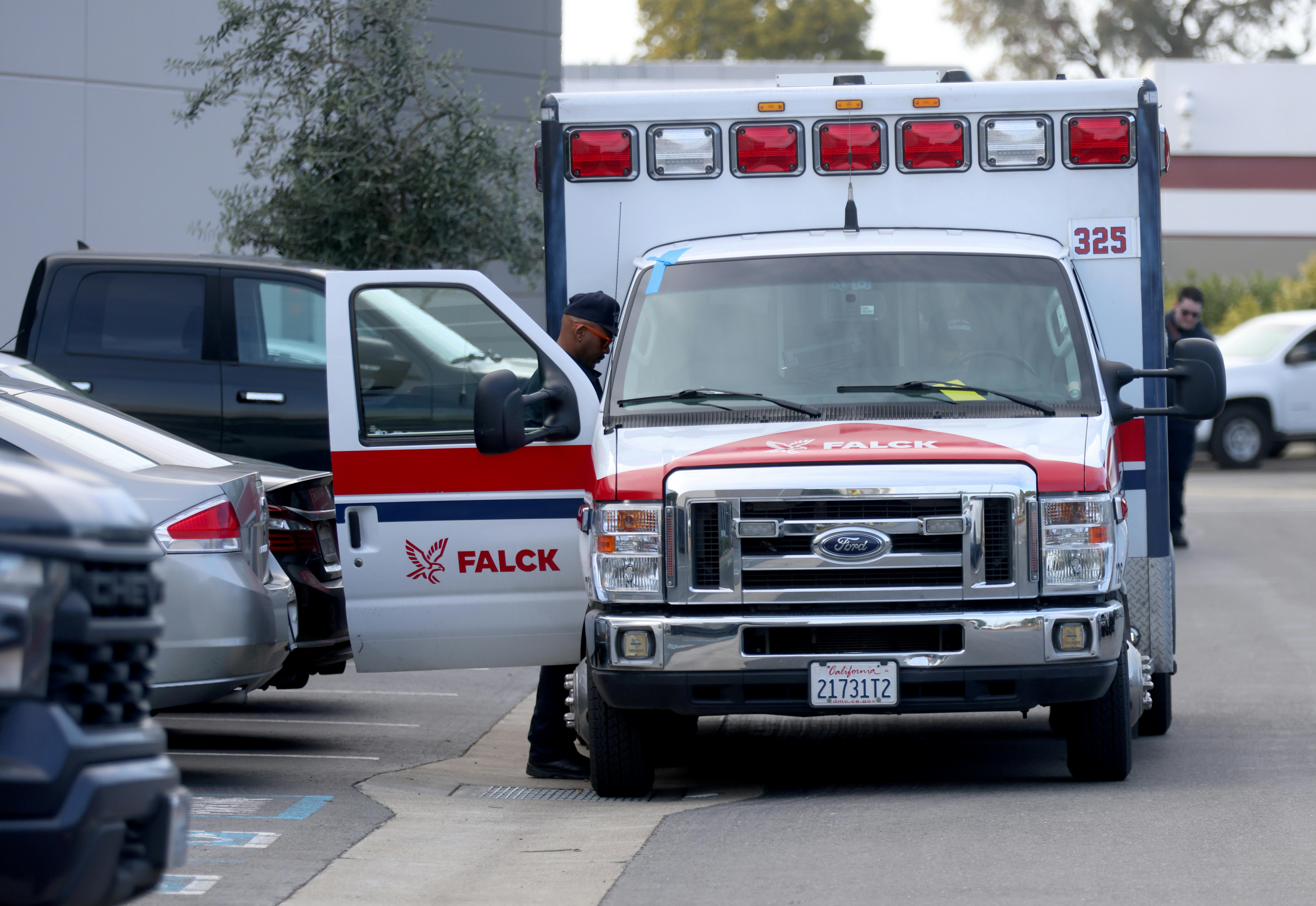 A Falck ambulance is checked out by EMS personnel.