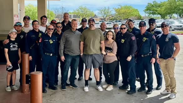 Arlington firefighter Brady Weaver (center, green shirt) was released a week after he was shot while responding to a welfare check.