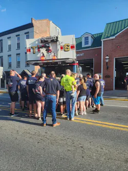 Firefighters and citizens pushed Tower 6 into the station Monday night. Firefighters and citizens pushed Tower 6 into the station Monday night.