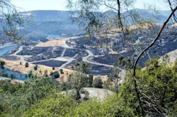 Smoke rises from charred earth near the Oroville Spillway during the Thompson Fire. Smoke rises from charred earth near the Oroville Spillway during the Thompson Fire.