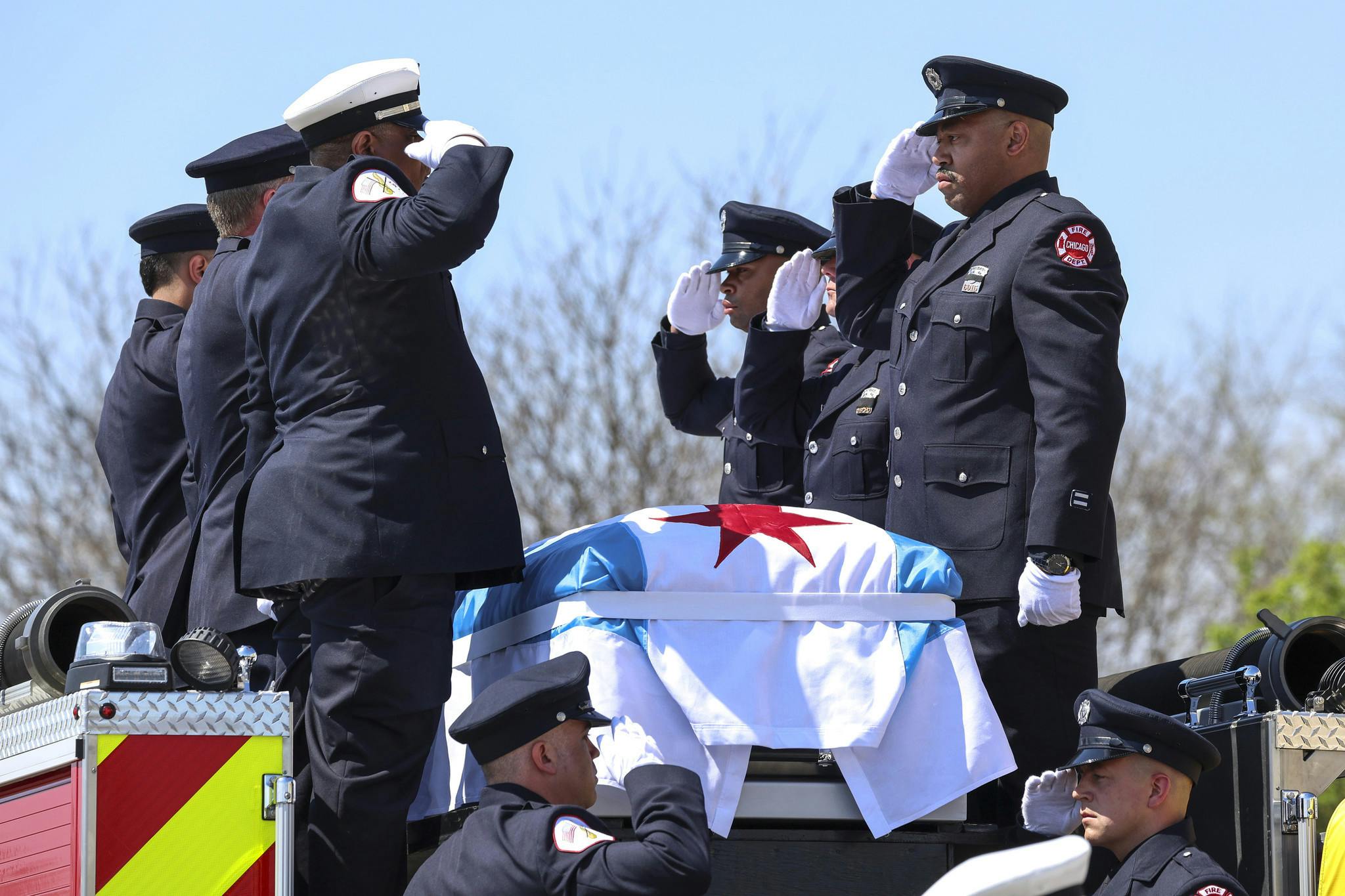 Chicago Firefighter Jermaine Pelt is saluted by colleagues.