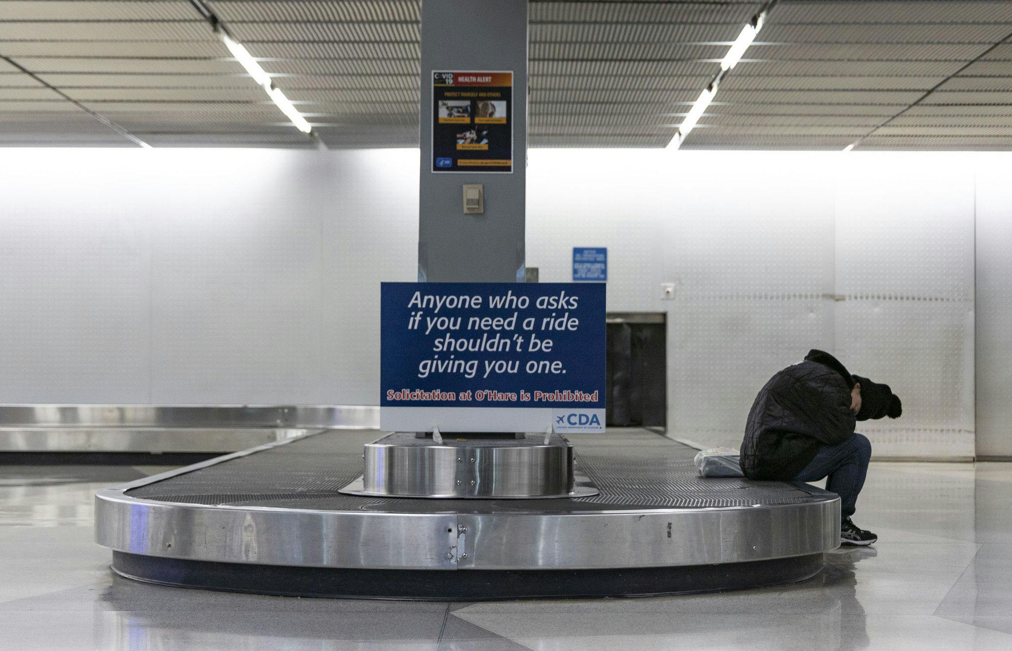 In this file photo, a homeless person is seen sleeping inside O'Hare International Airport Terminal earlier this year.