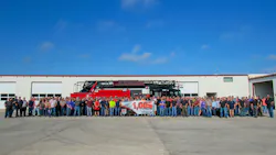 Workers pose with the 1,000th 105-foot Smeal aerial apparatus that was completed at their Snyder, NE, facility. The aerial ladder was built for the Wilmer, TX, Fire Department. Workers pose with the 1,000th 105-foot Smeal aerial apparatus that was completed at their Snyder, NE, facility. The aerial ladder was built for the Wilmer, TX, Fire Department.