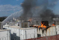 Firefighters apply water as fire burns through a lithium battery storage container at the San Diego Gas and Electric N.E. Operations Center in Escondido. Firefighters apply water as fire burns through a lithium battery storage container at the San Diego Gas and Electric N.E. Operations Center in Escondido.