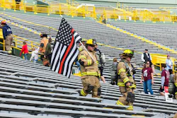 Climbers varied from wearing full turnout gear to masks to carrying flags. Climbers varied from wearing full turnout gear to masks to carrying flags.