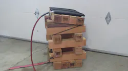 Photo 7: Sloped, lashed crib stack with secured air lifting bag. Photo 7: Sloped, lashed crib stack with secured air lifting bag.