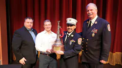 Freeport firefighter Petros Mestheneas (second from right) received the Michael O. McNamee Award of Valor at FireFusion for his rescue efforts of two firefighters. He receievd the award from FireFusion Conference Director Peter Matthews (left to right), Robert Daus Jr. from Liberty Artworks and Freeport Fire Department Executive Director Ray Maguire. Freeport firefighter Petros Mestheneas (second from right) received the Michael O. McNamee Award of Valor at FireFusion for his rescue efforts of two firefighters. He receievd the award from FireFusion Conference Director Peter Matthews (left to right), Robert Daus Jr. from Liberty Artworks and Freeport Fire Department Executive Director Ray Maguire.