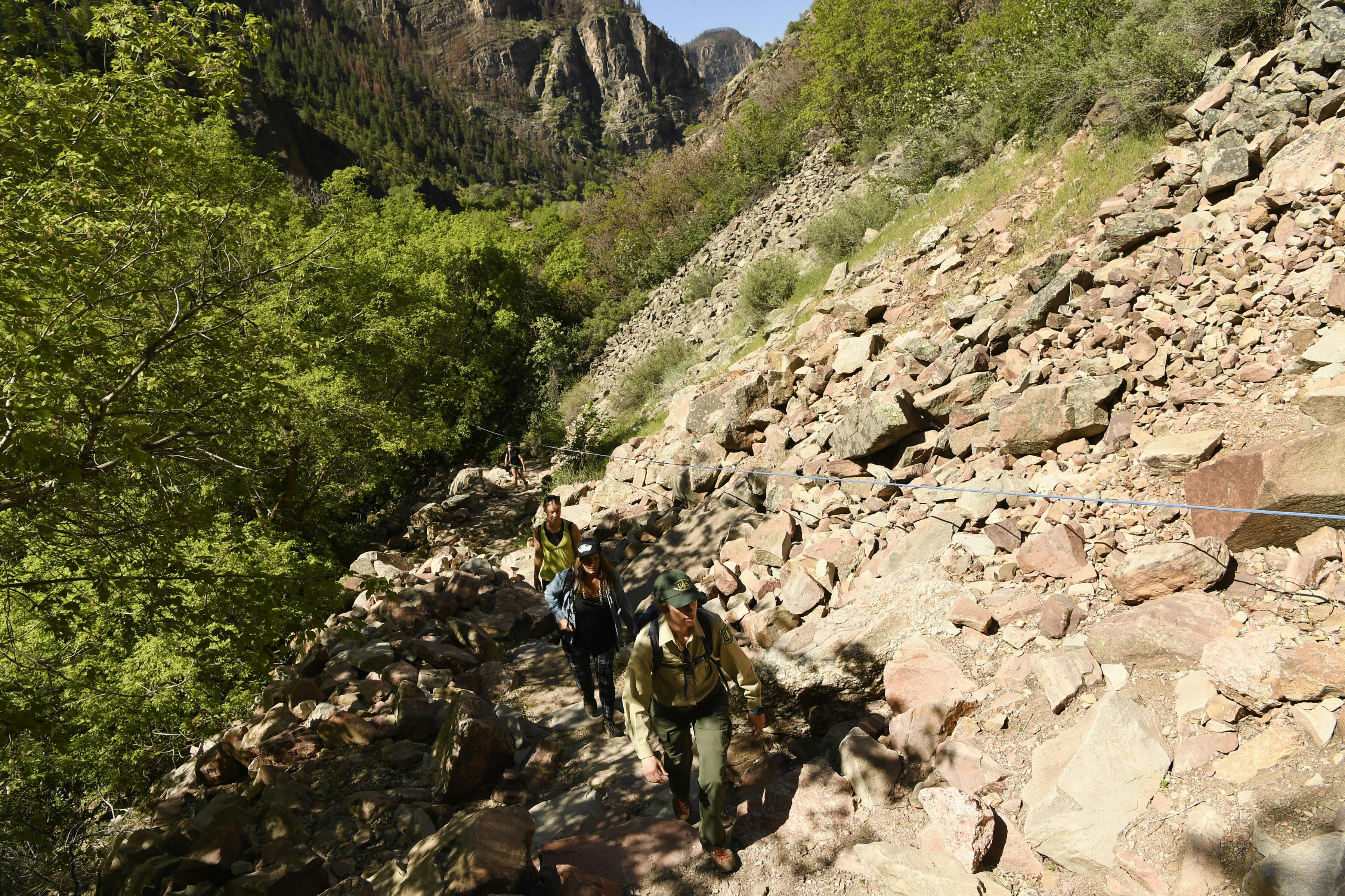 Glenwood Canyon Manager Colleen Pennington hikes the trail to Hanging Lake in May 2022, near Glenwood Springs, CO. Hanging Lake survived the Grizzly Creek fire that burned 33,000 acres in 2020, but the damage triggered a series of floods that led to closures off and on in the years since.